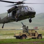 Soldiers with the 19th Special Forces and 2nd Battalion 211th Aviation Regiment conduct sling load operations during annual training at Camp Williams.